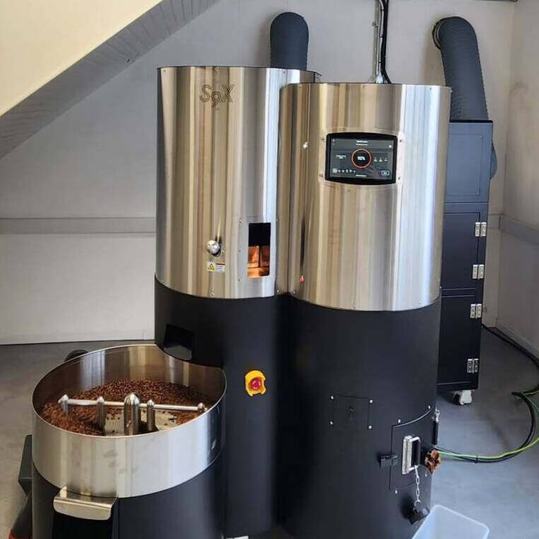 The Stronghold S9X roaster with roasted beans in the cooling tray.